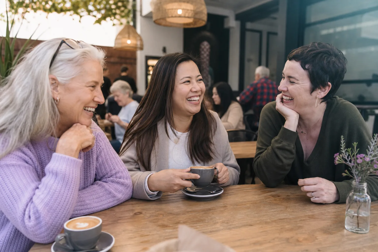 Woman enjoying a relaxed conversation over coffee in Derbyshire